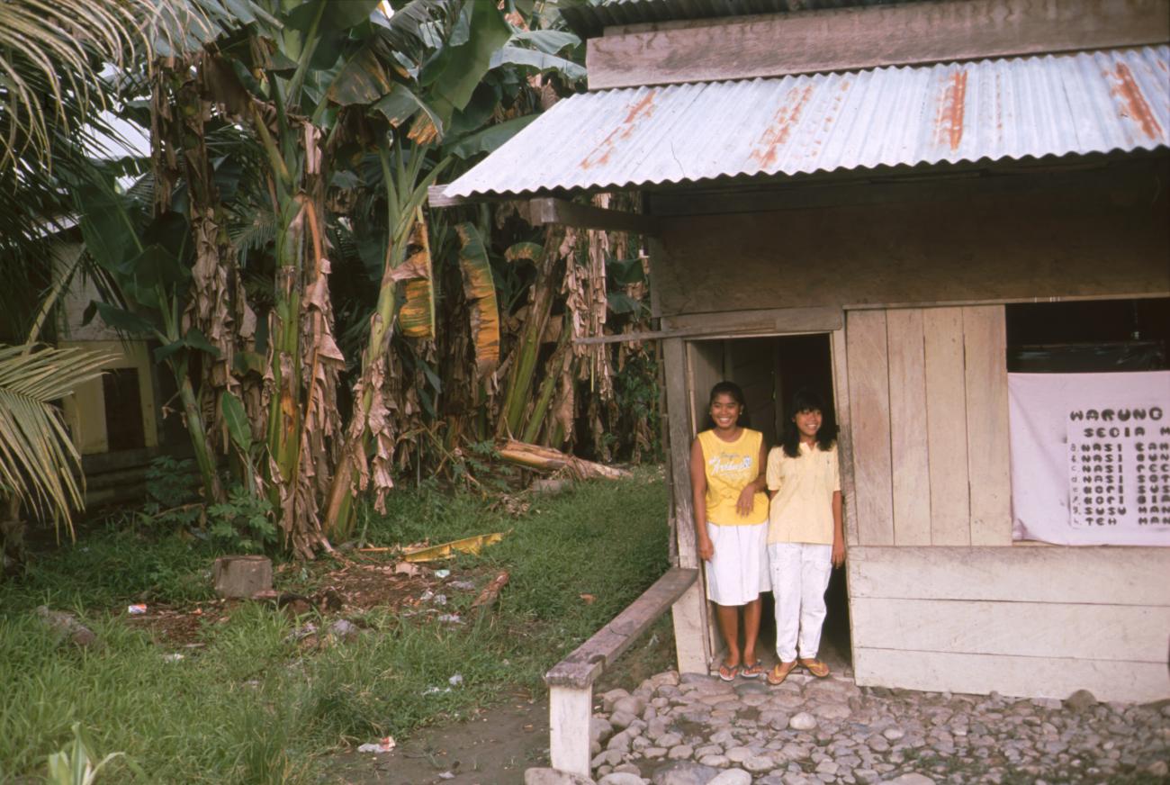 BD/166/303 -
Two women in the door opening of a restaurant