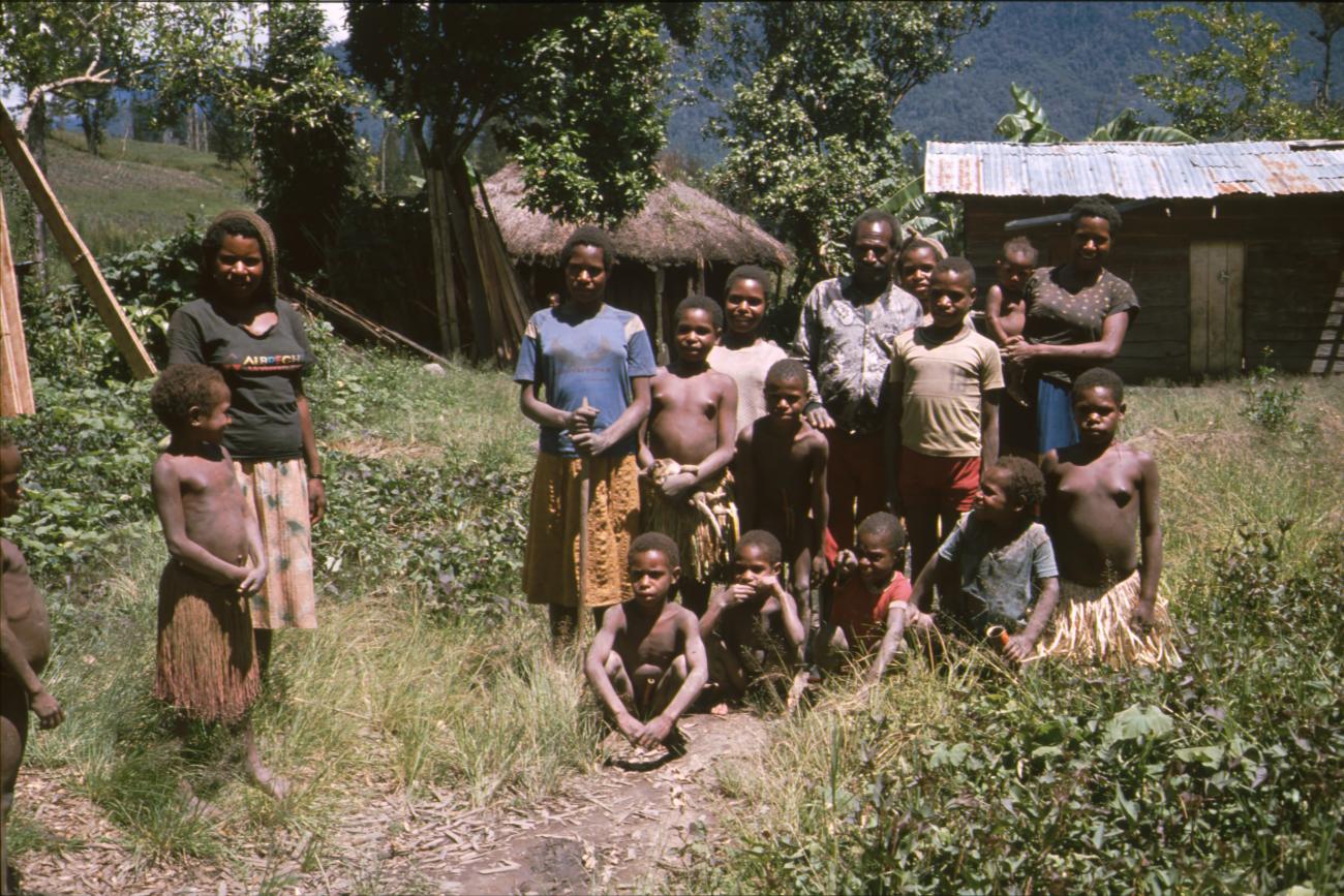 BD/166/372 -
Group of Papua people in front of their house