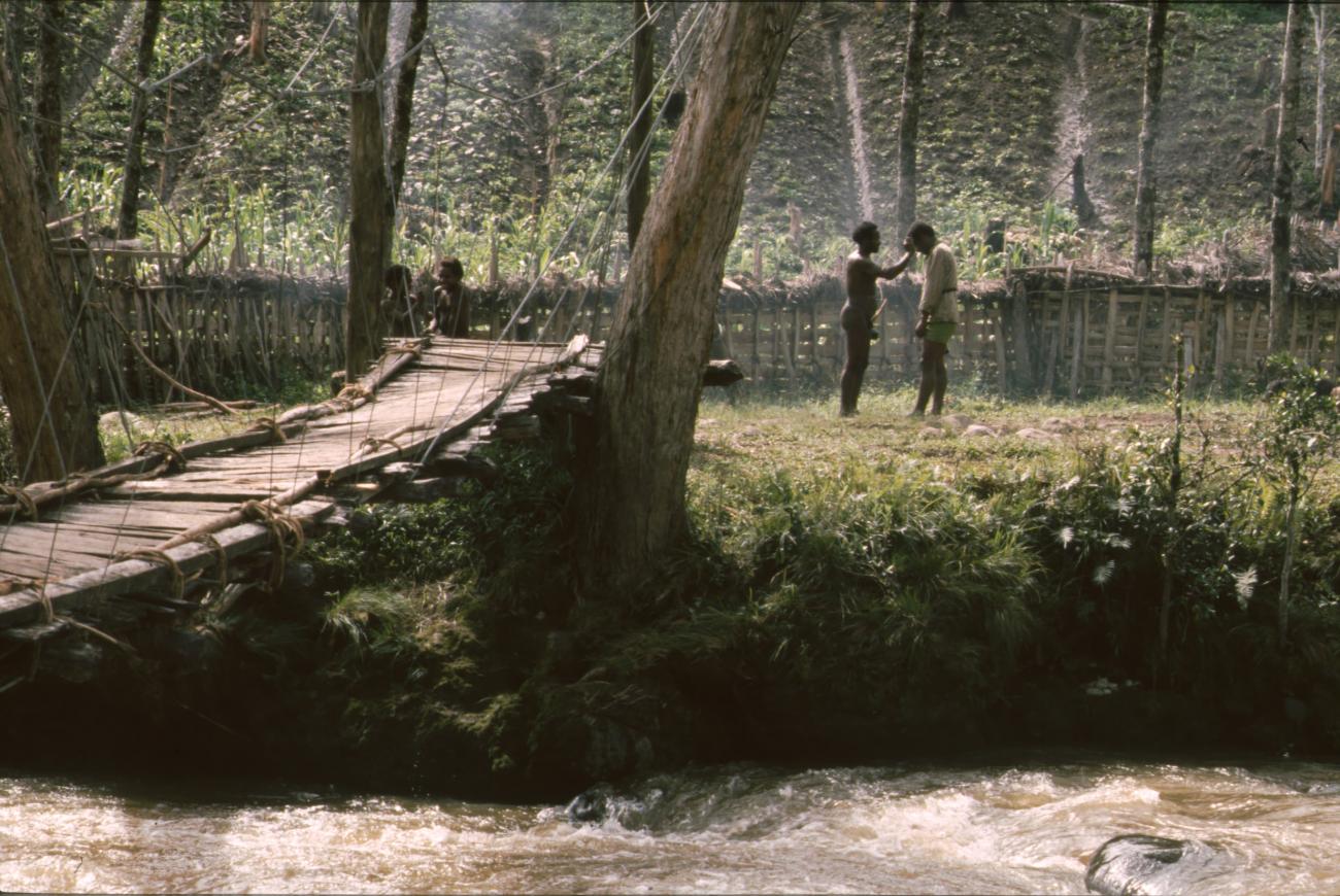 BD/166/426 -
Two men on the shore near the suspension bridge