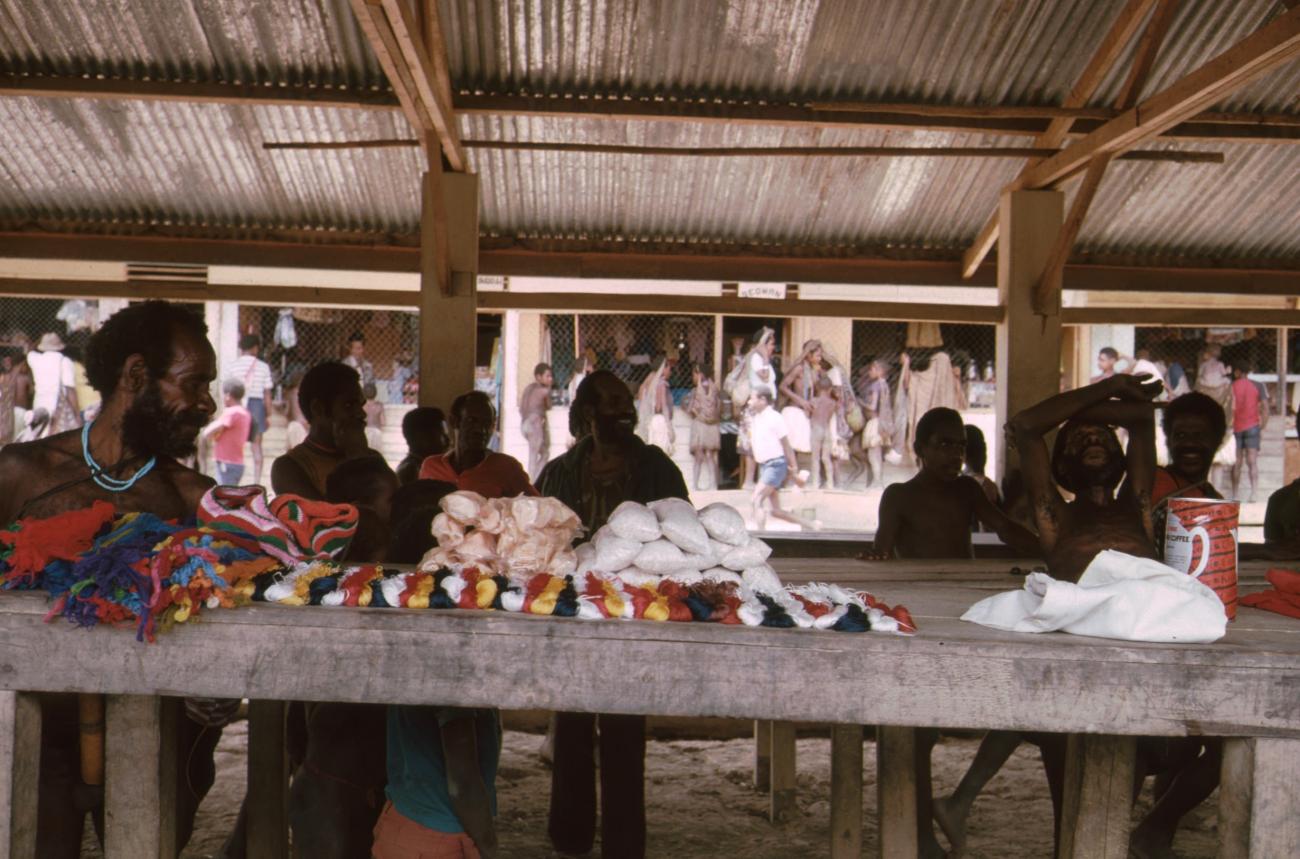 BD/166/75 -
Textile and packaged food is displayed on covered market 3