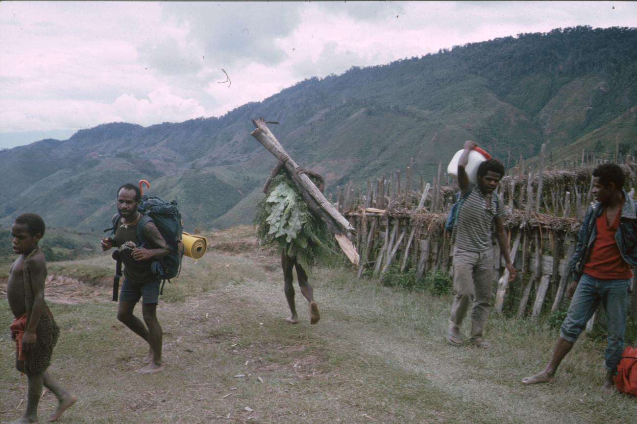 BD/166/86 -
Man with huge piles and leaves on his back